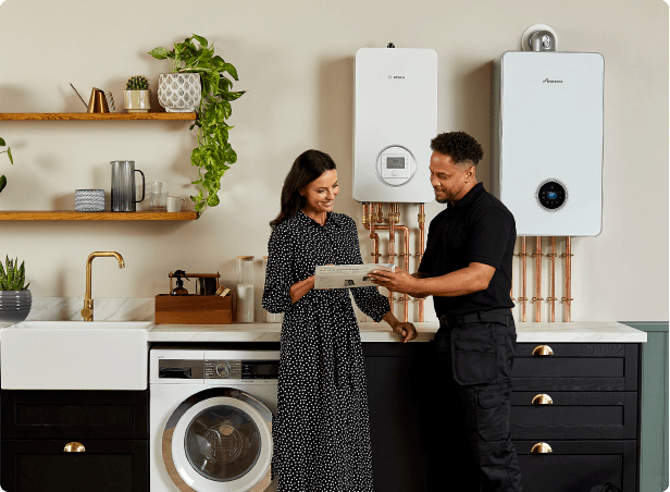 Gas Safe Engineer Talking To Woman About New Boiler Installations